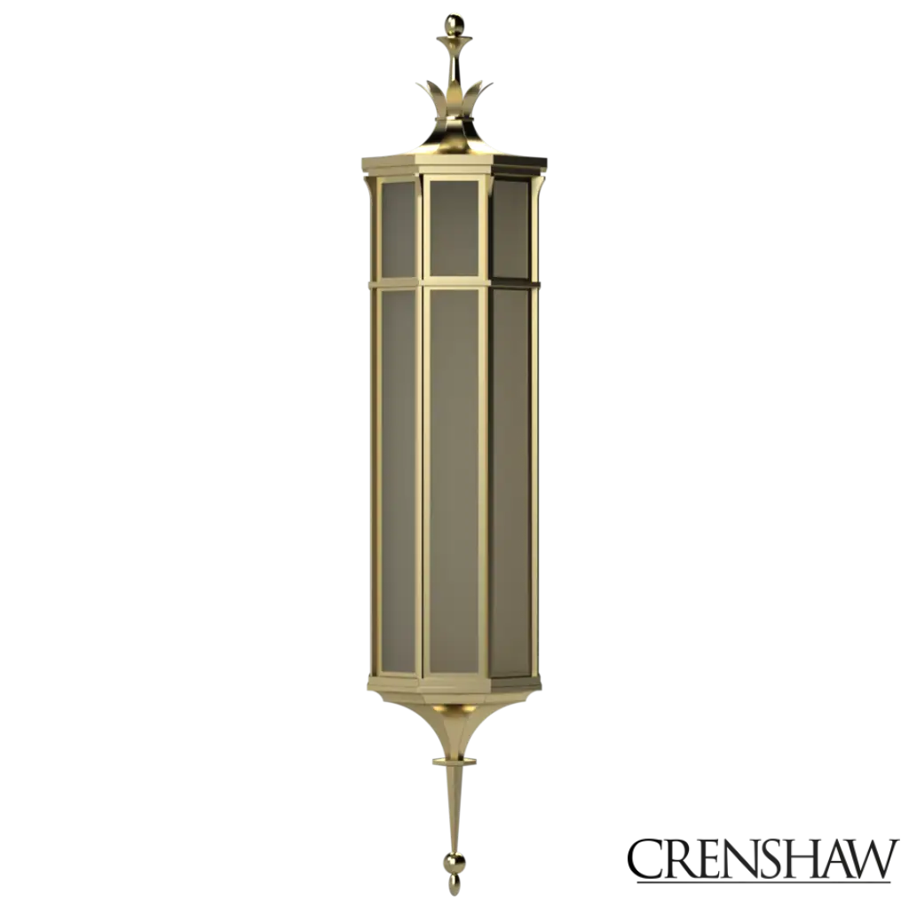 Decorative wall lantern with gold and black design on a white background