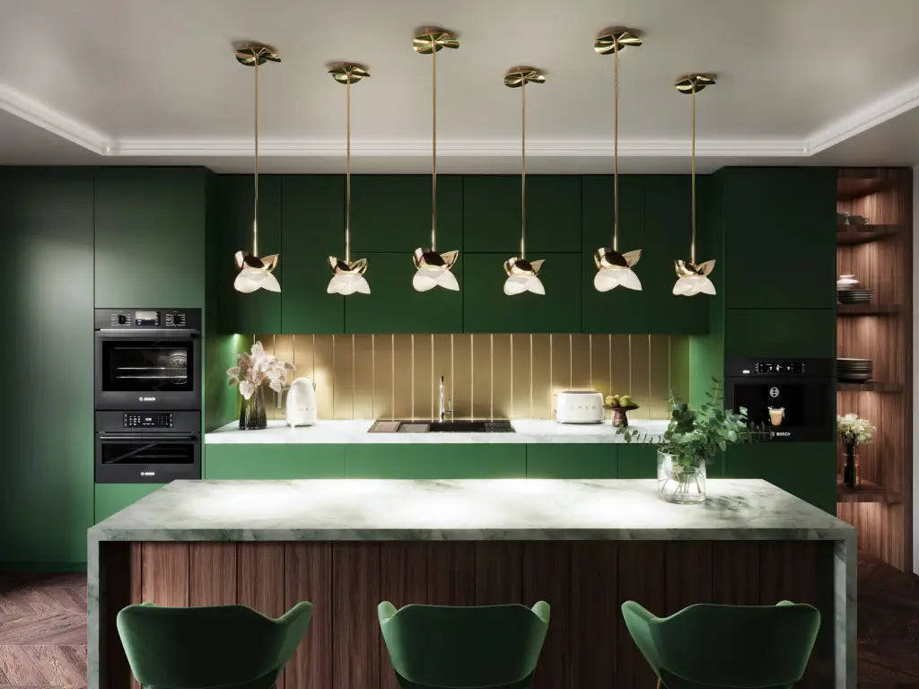 Modern kitchen with green cabinets, marble countertop, and pendant lights.