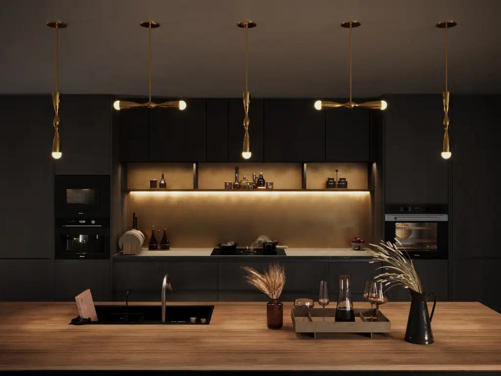 Modern kitchen with dark walls, pendant lights, and a wooden countertop.