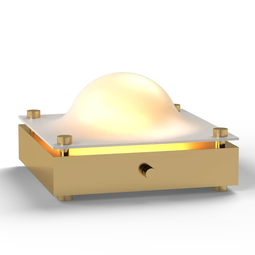 Gold table lamp with a spherical glass top and gold base on a white background