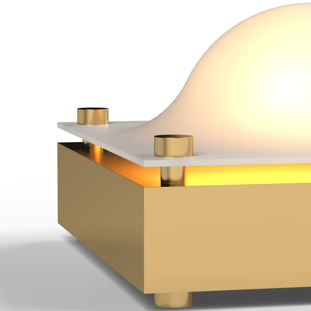 Modern table lamp with gold base and white shade on a light gray background