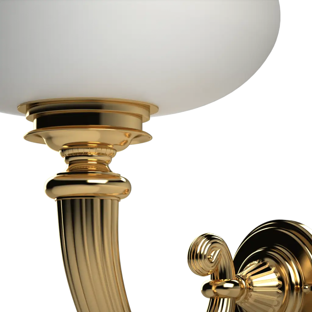 A gilded wall sconce with a white glass shade.