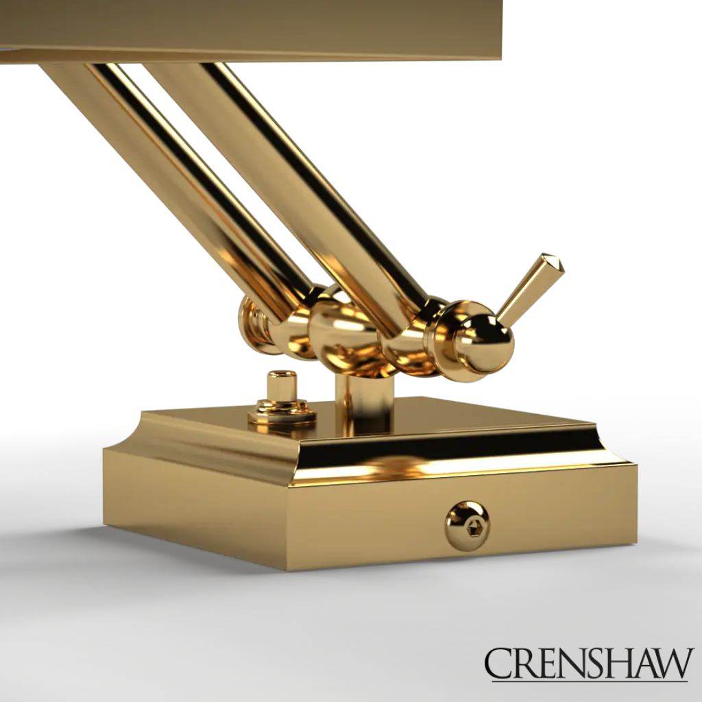 Gold metal table lamp with adjustable arm on a white background