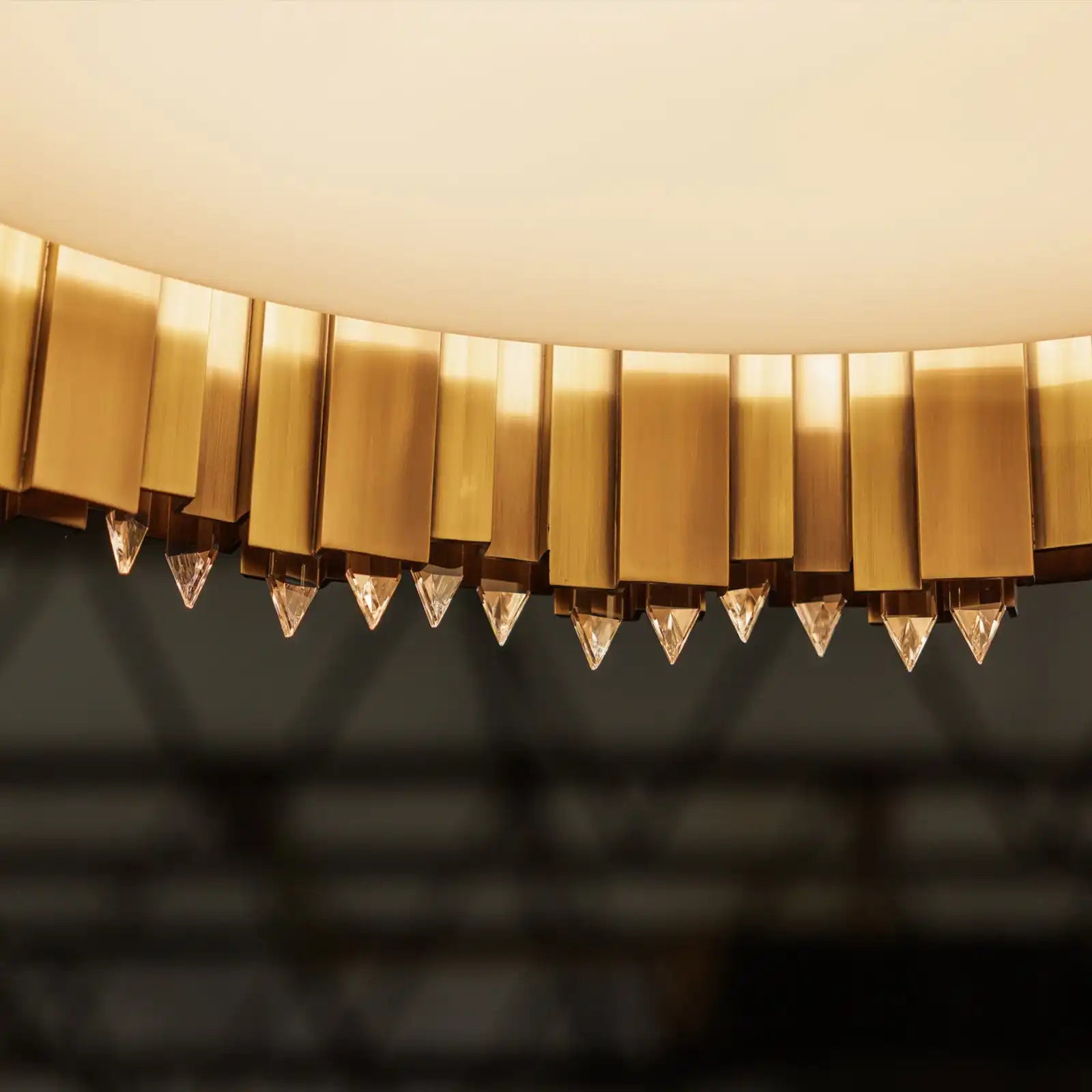 A gold chandelier with clear crystal drops.