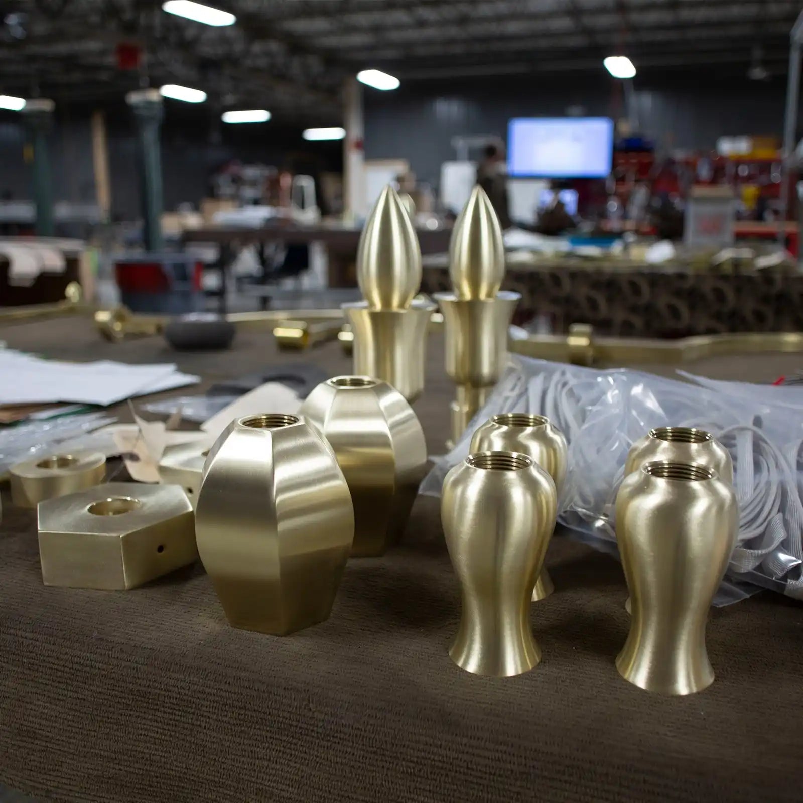 Various unfinished brass lamp parts.