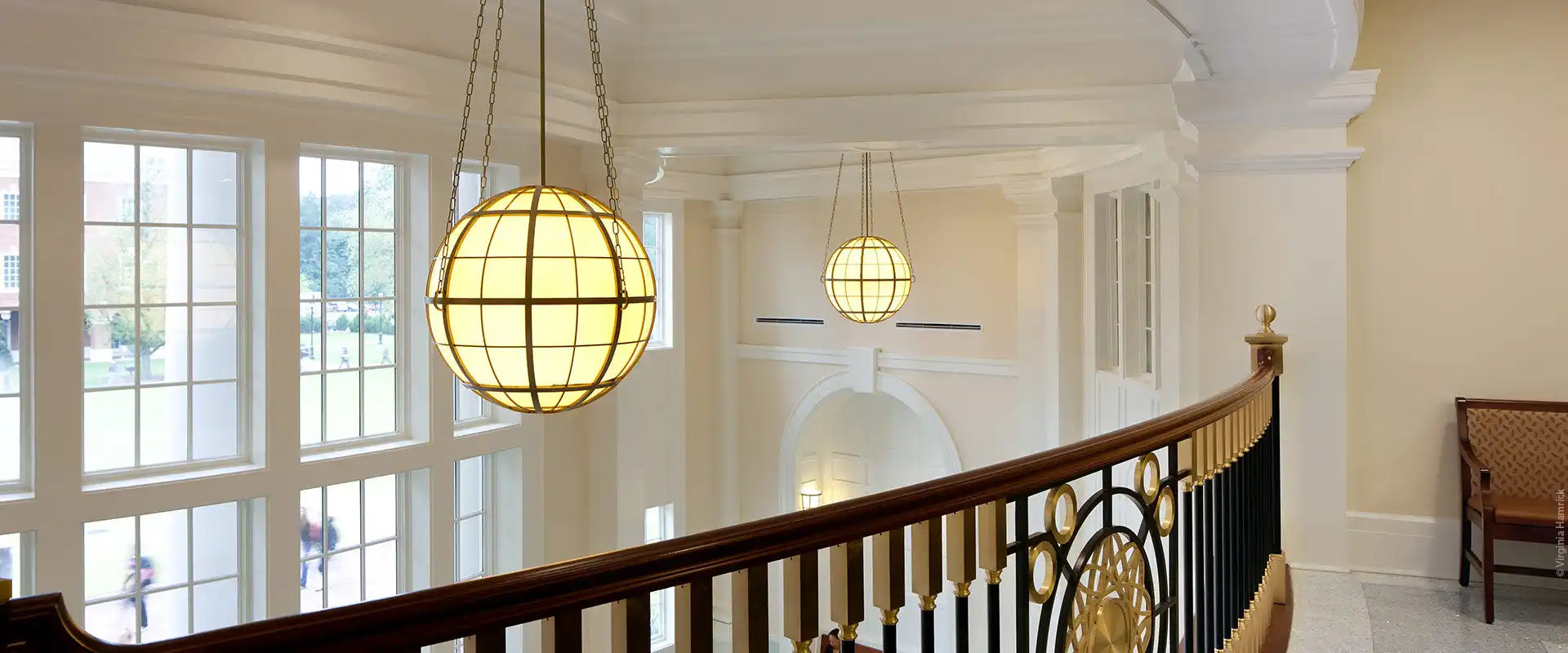 A decorative spherical light fixture with a grid pattern.