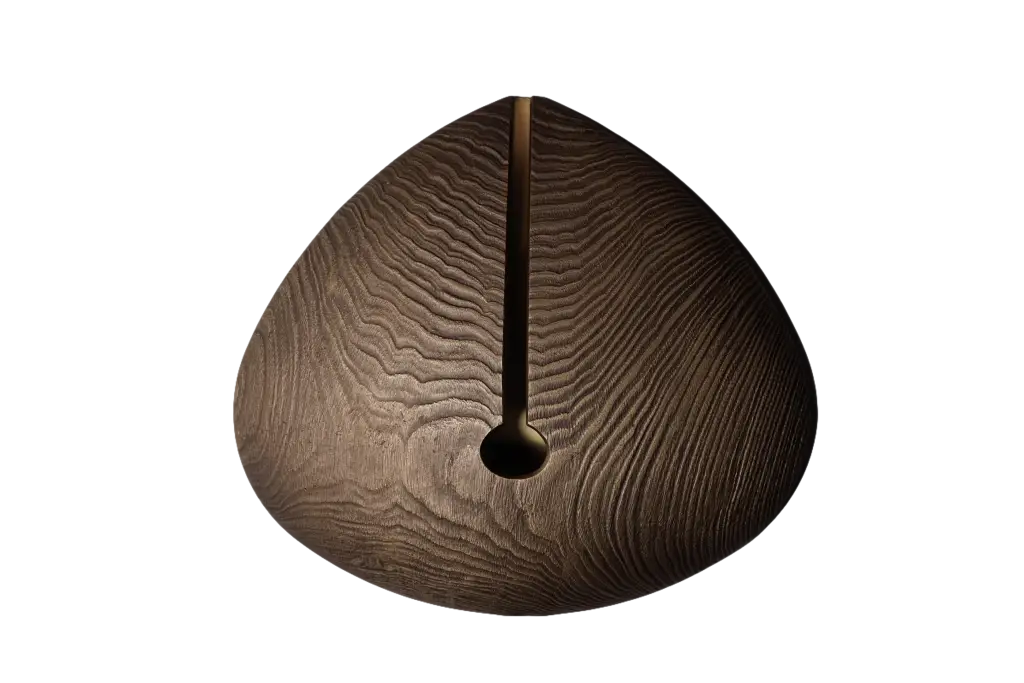 A teardrop-shaped wooden wall sconce with a vertical slit and a circular opening at the bottom.