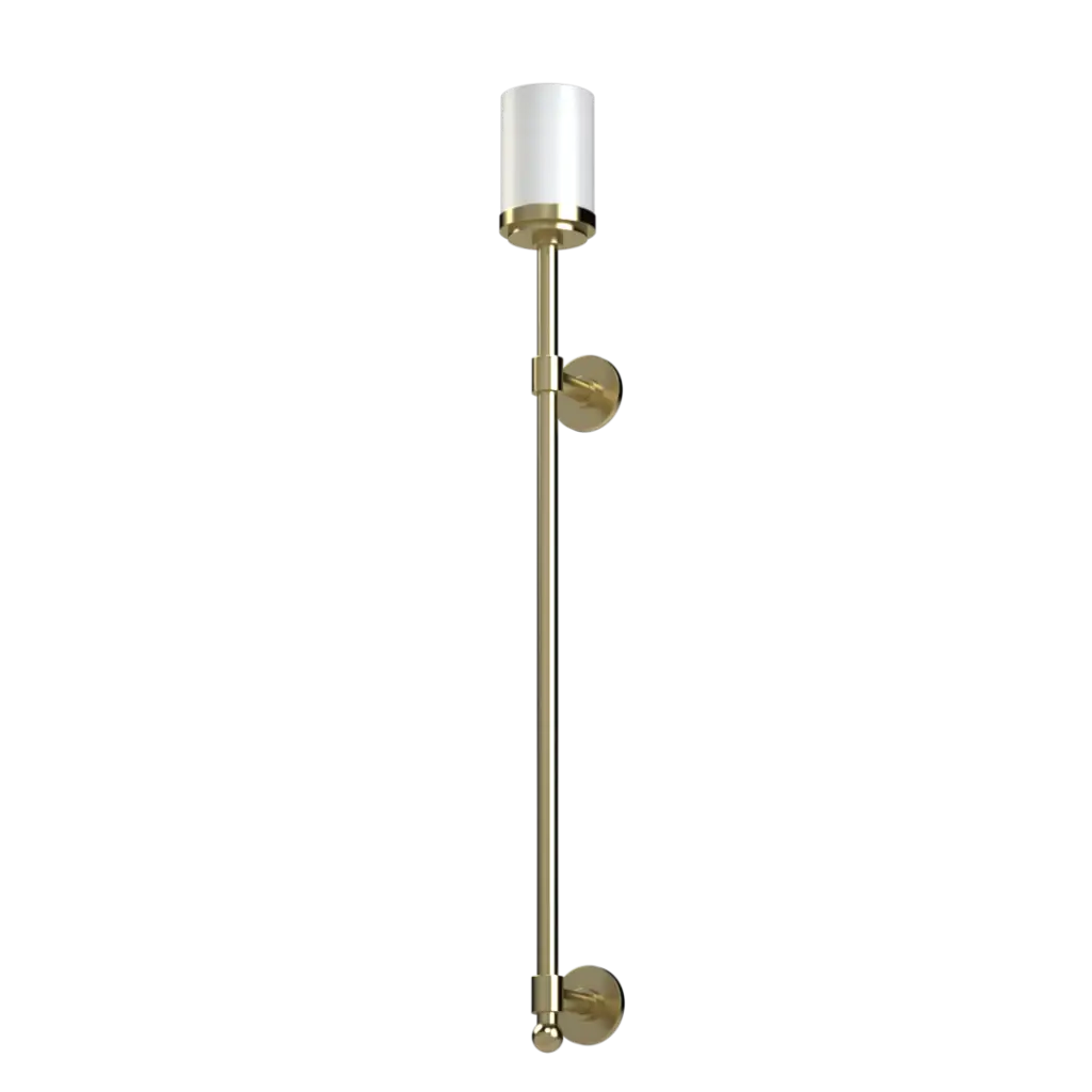 A tall, slender brass wall sconce with a cylindrical white glass shade.