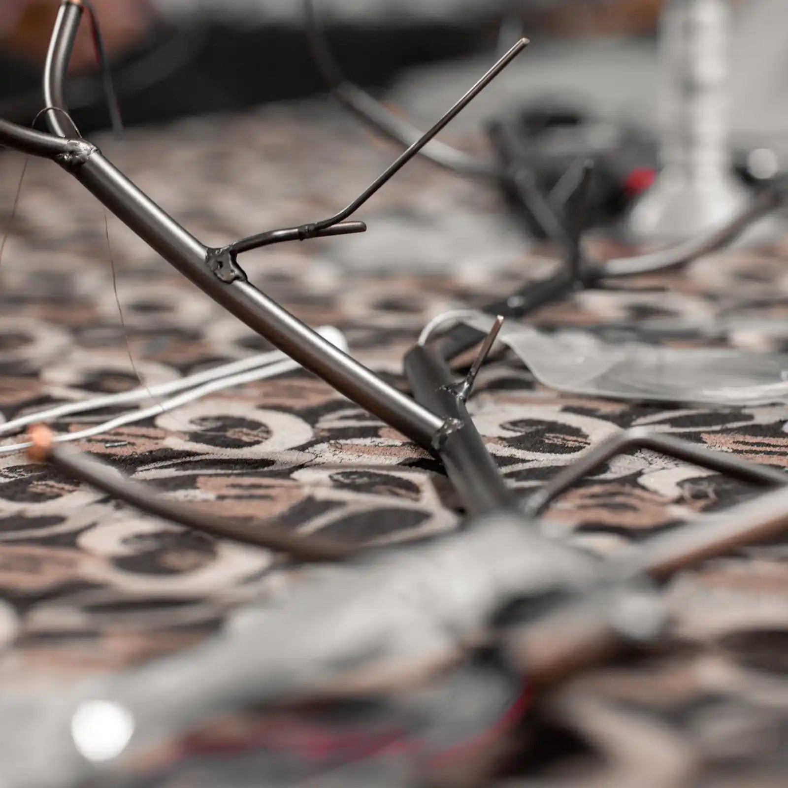 Metallic frame of an unfinished or broken drone.