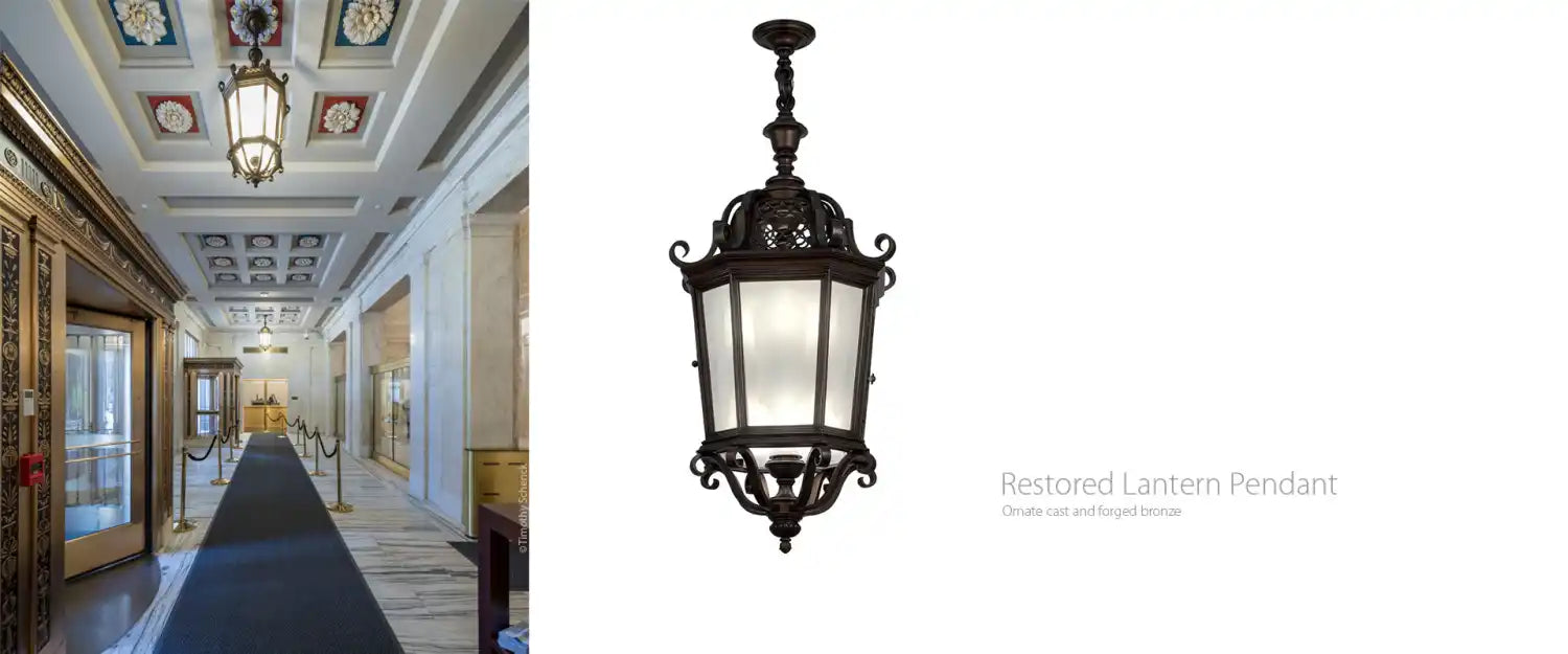 Ornate dark-finished metal lantern pendant with frosted glass panels.